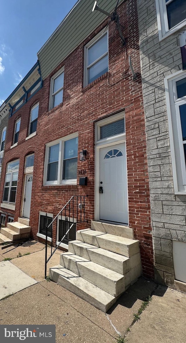 2116 E Hoffman St, Baltimore, MD 21213 - property entrance featuring brick siding