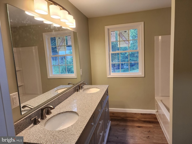 51 Maple St, Cumberland, MD 21502 - bathroom with wood finished floors, plenty of natural light, baseboards, and double vanity