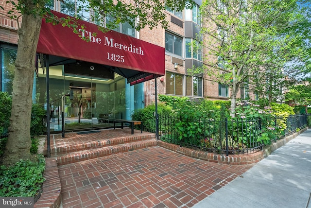 1825 T St NW Unit 701, Washington, DC 20009 - view of exterior entry featuring brick siding