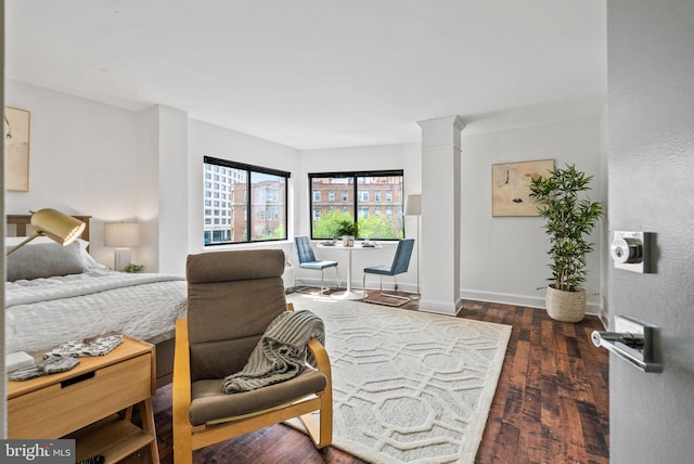 1825 T St NW Unit 701, Washington, DC 20009 - bedroom with wood finished floors, decorative columns, and baseboards