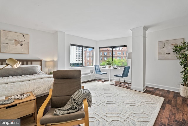 1825 T St NW Unit 701, Washington, DC 20009 - bedroom with decorative columns, wood finished floors, and baseboards