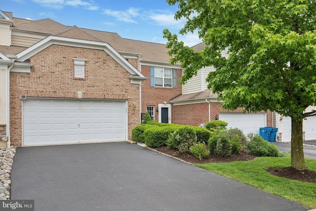 2136 Sugar Maple Ln, Furlong, PA 18925 - view of front of home with brick siding, asphalt driveway, and roof with shingles