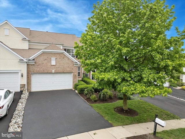 2136 Sugar Maple Ln, Furlong, PA 18925 - view of front facade with asphalt driveway, a garage, a shingled roof, and brick siding