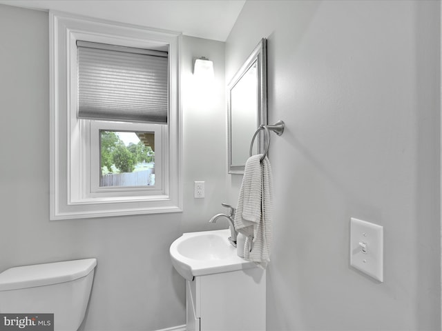 546 N Plum St, Lancaster, PA 17602 - bathroom with vanity, toilet, and baseboards