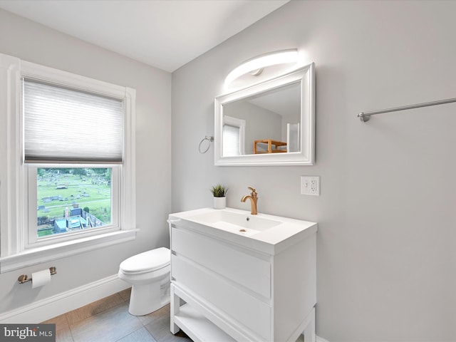 546 N Plum St, Lancaster, PA 17602 - half bath featuring vanity, baseboards, and toilet