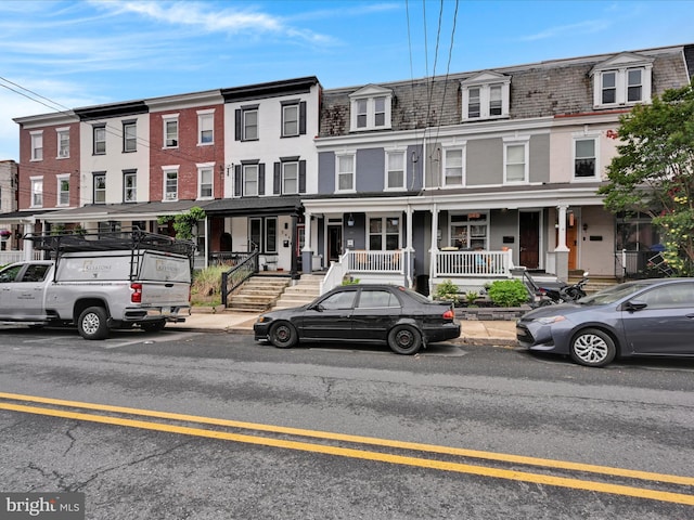546 N Plum St, Lancaster, PA 17602 - townhome / multi-family property with mansard roof, covered porch, and a high end roof