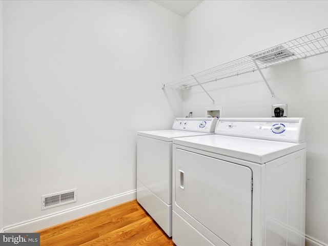 1082 Stillwood Cir, Lititz, PA 17543 - washroom with washer and dryer and light wood-style floors
