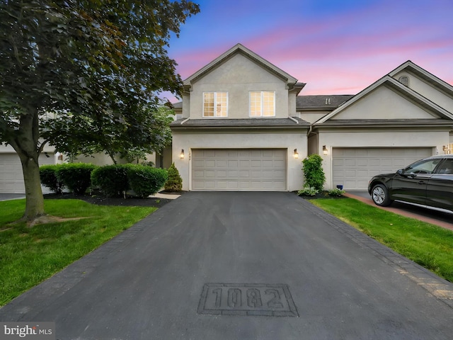 1082 Stillwood Cir, Lititz, PA 17543 - view of front of house featuring driveway, stucco siding, and a front yard