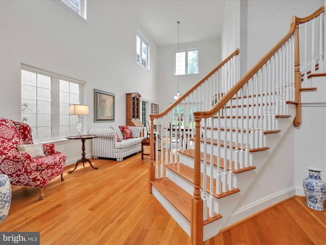1082 Stillwood Cir, Lititz, PA 17543 - stairs with wood finished floors and a towering ceiling
