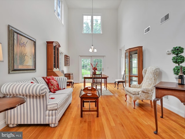 1082 Stillwood Cir, Lititz, PA 17543 - living room featuring plenty of natural light, light wood-style flooring, and a towering ceiling