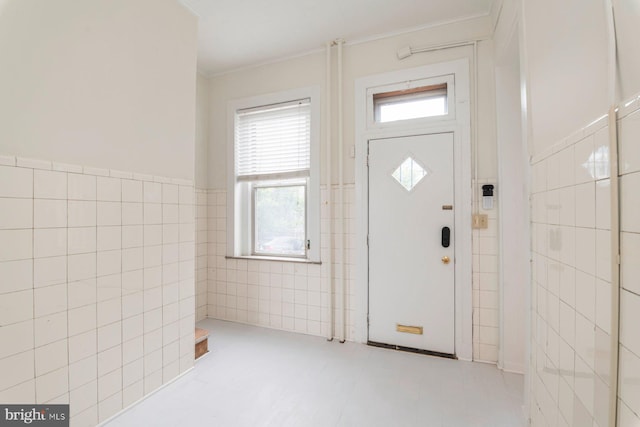 2638 E Baltimore St, Baltimore, MD 21224 - entrance foyer with tile walls, ornamental molding, and a wainscoted wall