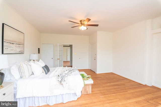 2638 E Baltimore St, Baltimore, MD 21224 - bedroom featuring light wood-style floors, baseboards, and a ceiling fan
