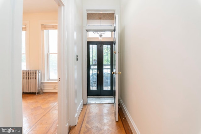 2638 E Baltimore St, Baltimore, MD 21224 - foyer featuring radiator heating unit, french doors, and baseboards