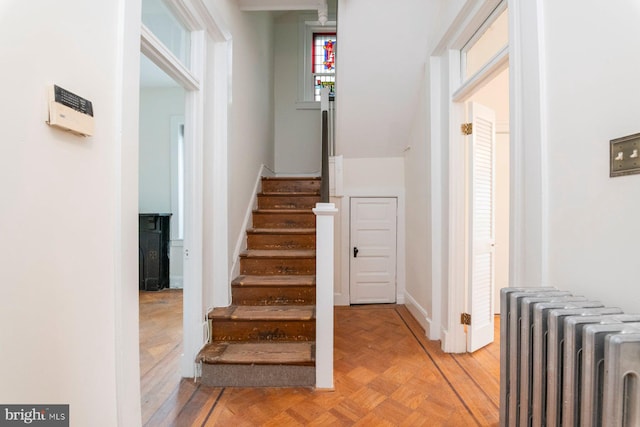 2638 E Baltimore St, Baltimore, MD 21224 - stairs featuring radiator heating unit and baseboards