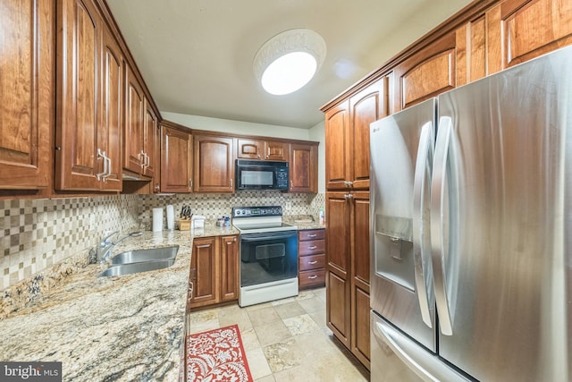 6101 Edsall Rd Unit 702, Alexandria, VA 22304 - kitchen with stainless steel refrigerator with ice dispenser, electric range, black microwave, a sink, and backsplash