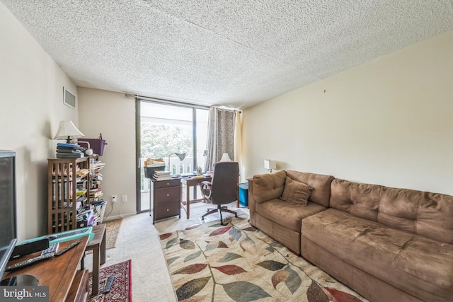6101 Edsall Rd Unit 702, Alexandria, VA 22304 - carpeted living room with an office area, a textured ceiling, and floor to ceiling windows
