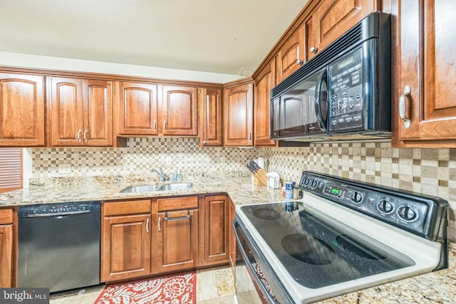 6101 Edsall Rd Unit 702, Alexandria, VA 22304 - kitchen featuring black appliances, a sink, light stone counters, and brown cabinets