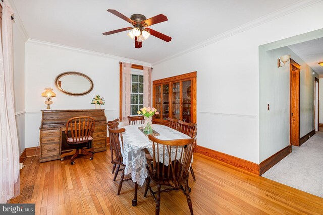 212 S Union Ave, Havre De Grace, MD 21078 - dining room featuring baseboards, light wood finished floors, ceiling fan, and ornamental molding