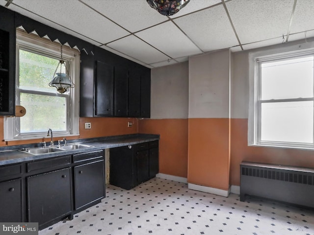 16 Avalon Ave, Hagerstown, MD 21740 - kitchen featuring radiator heating unit, a sink, a drop ceiling, dark countertops, and dark cabinetry