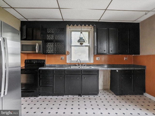16 Avalon Ave, Hagerstown, MD 21740 - kitchen with stainless steel appliances, a sink, dark cabinets, and a drop ceiling