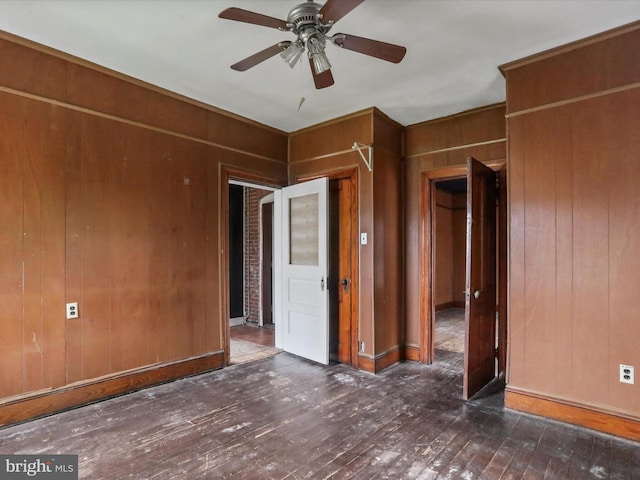 16 Avalon Ave, Hagerstown, MD 21740 - unfurnished room with wood-type flooring, wood walls, and ceiling fan