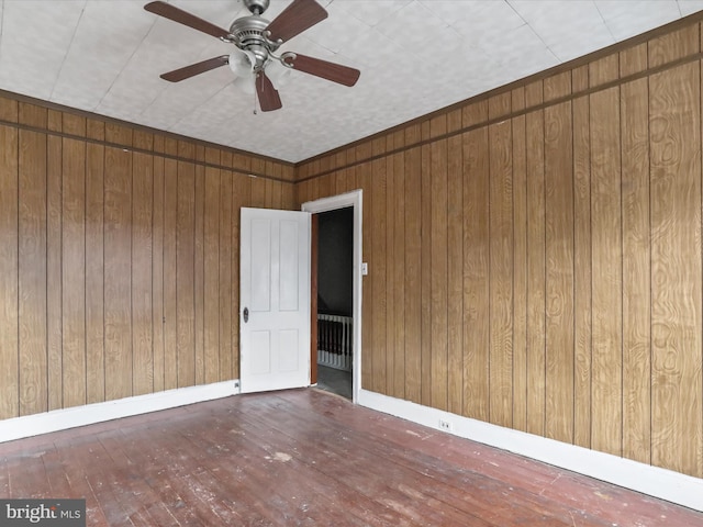 16 Avalon Ave, Hagerstown, MD 21740 - unfurnished room featuring hardwood / wood-style floors, wooden walls, ceiling fan, and baseboards