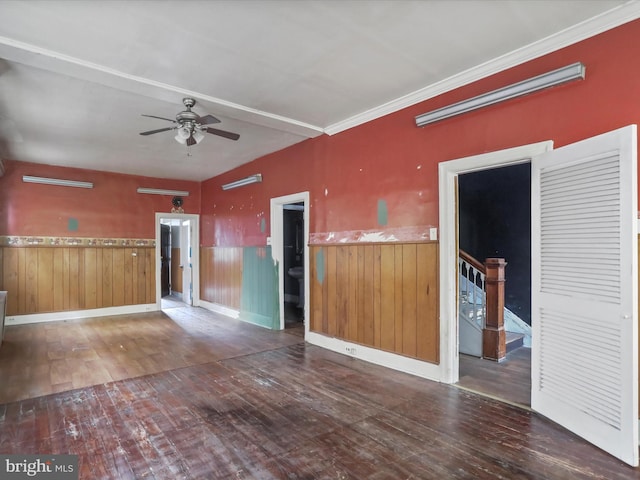 16 Avalon Ave, Hagerstown, MD 21740 - empty room featuring a ceiling fan, wainscoting, hardwood / wood-style floors, and wood walls