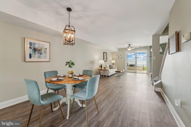 15 Queen Anne Way Unit E, Chester, MD 21619 - dining area featuring wood finished floors, baseboards, and a chandelier