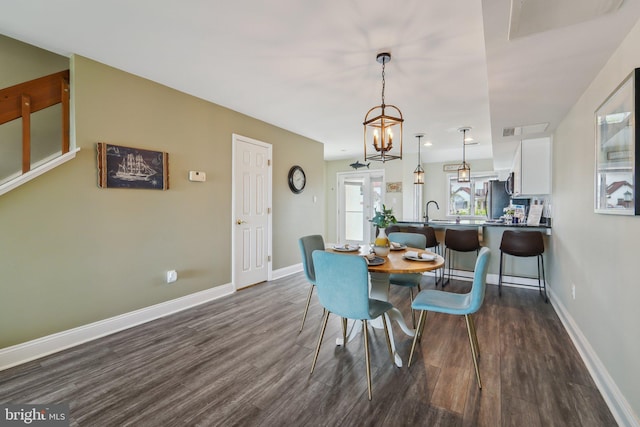 15 Queen Anne Way Unit E, Chester, MD 21619 - dining space with dark wood-style flooring and baseboards