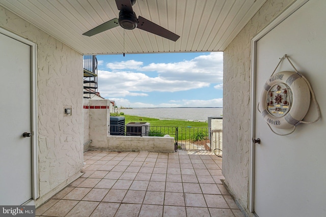 15 Queen Anne Way Unit E, Chester, MD 21619 - view of patio featuring a water view, a ceiling fan, and cooling unit