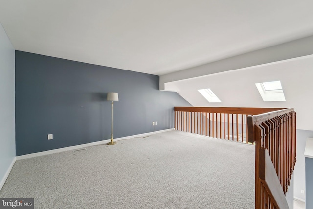 15 Queen Anne Way Unit E, Chester, MD 21619 - bonus room with a skylight, carpet floors, baseboards, and vaulted ceiling