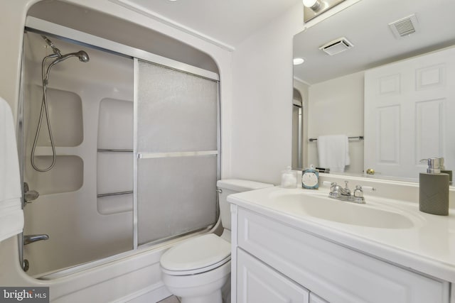 15 Queen Anne Way Unit E, Chester, MD 21619 - bathroom featuring toilet, vanity, and combined bath / shower with glass door