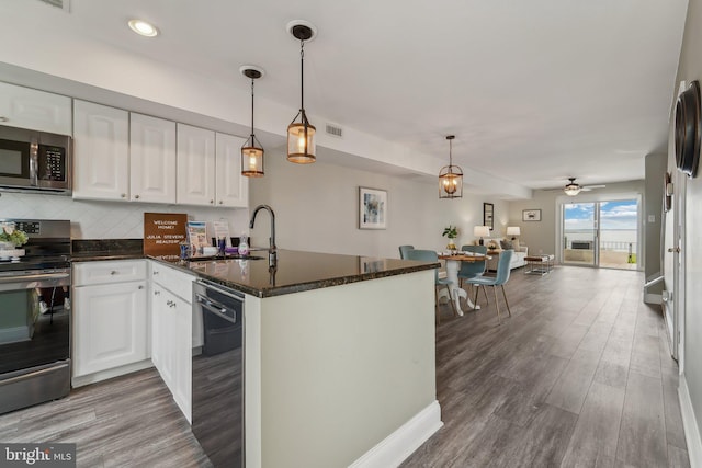 15 Queen Anne Way Unit E, Chester, MD 21619 - kitchen with appliances with stainless steel finishes, a sink, open floor plan, white cabinets, and recessed lighting