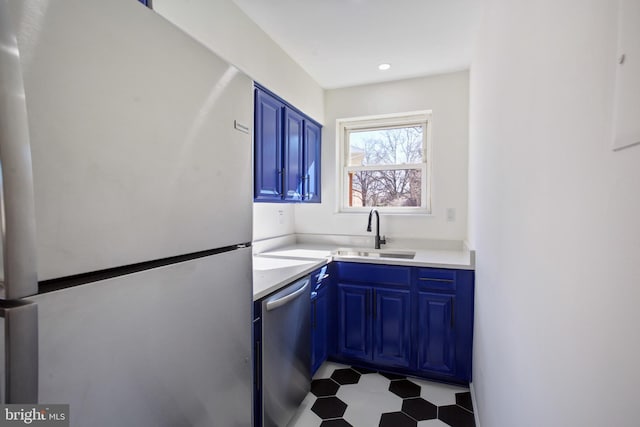 3059 Patrick Henry Dr Unit 201, Falls Church, VA 22044 - kitchen with appliances with stainless steel finishes, a sink, blue cabinets, and tile patterned floors