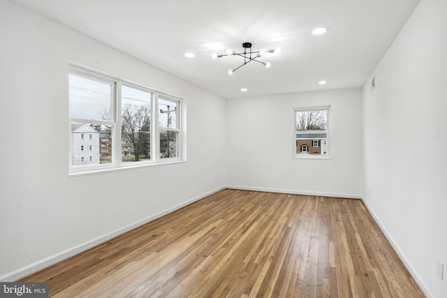 3059 Patrick Henry Dr Unit 201, Falls Church, VA 22044 - spare room with a chandelier, light wood-type flooring, baseboards, and recessed lighting