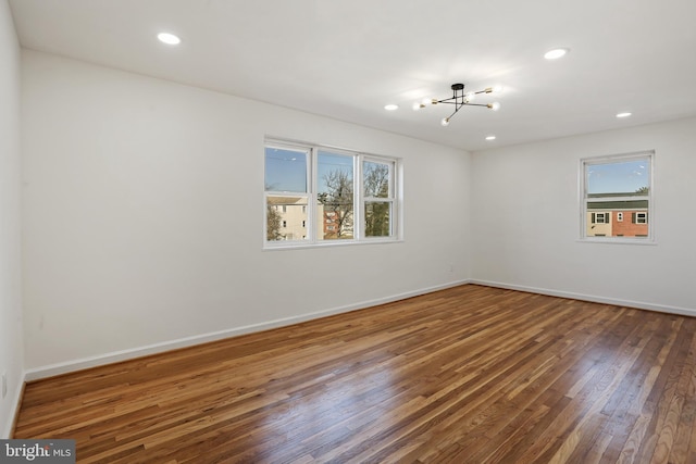 3059 Patrick Henry Dr Unit 201, Falls Church, VA 22044 - spare room featuring healthy amount of natural light, hardwood / wood-style flooring, a chandelier, recessed lighting, and baseboards
