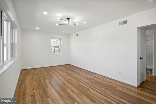 3059 Patrick Henry Dr Unit 201, Falls Church, VA 22044 - unfurnished room with wood finished floors, a chandelier, baseboards, and recessed lighting