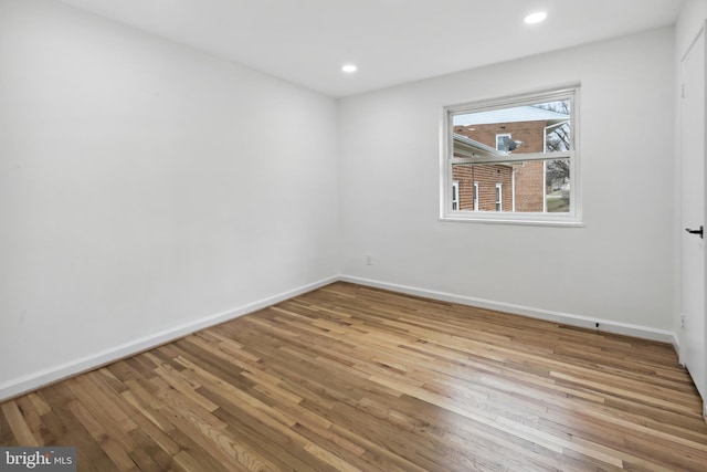 3059 Patrick Henry Dr Unit 201, Falls Church, VA 22044 - unfurnished room with wood finished floors, baseboards, and recessed lighting
