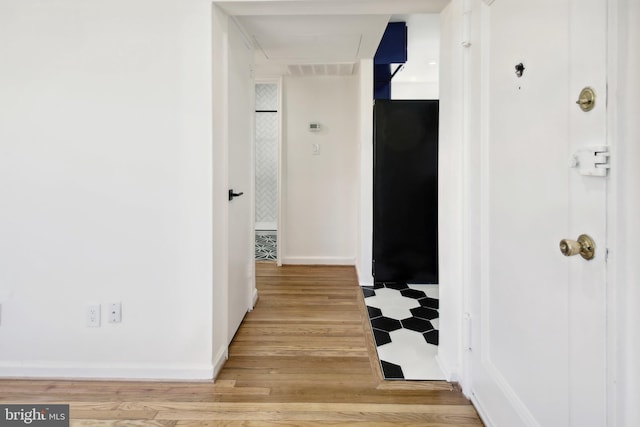3059 Patrick Henry Dr Unit 201, Falls Church, VA 22044 - hallway with light wood-style floors and baseboards