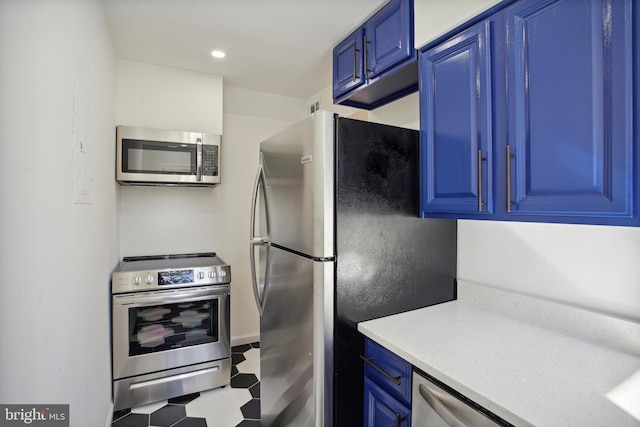 3059 Patrick Henry Dr Unit 201, Falls Church, VA 22044 - kitchen with stainless steel appliances, blue cabinetry, tile patterned floors, recessed lighting, and light stone countertops