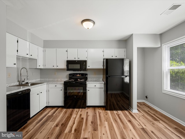 237 Kimberly Way, Winchester, VA 22601 - kitchen with black appliances, a sink, light countertops, light wood-style floors, and baseboards