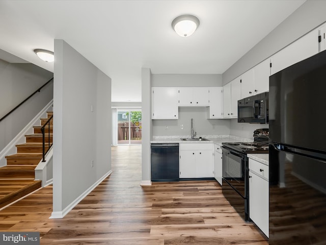 237 Kimberly Way, Winchester, VA 22601 - kitchen featuring black appliances, a sink, light countertops, and light wood-style flooring