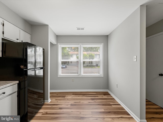 237 Kimberly Way, Winchester, VA 22601 - kitchen featuring freestanding refrigerator, light wood-style floors, white cabinets, and baseboards