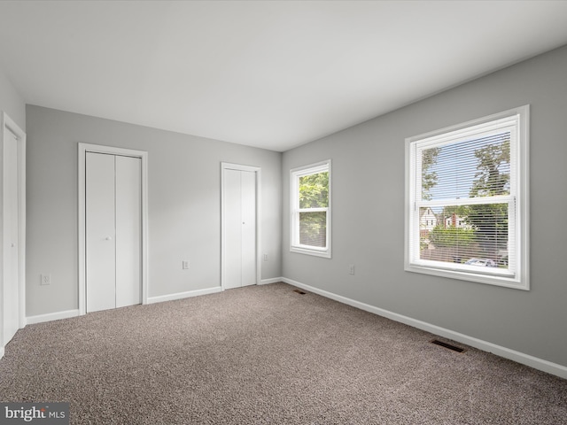 237 Kimberly Way, Winchester, VA 22601 - unfurnished bedroom with two closets, carpet flooring, and baseboards