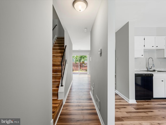 237 Kimberly Way, Winchester, VA 22601 - corridor featuring a sink, light wood-type flooring, stairway, and baseboards