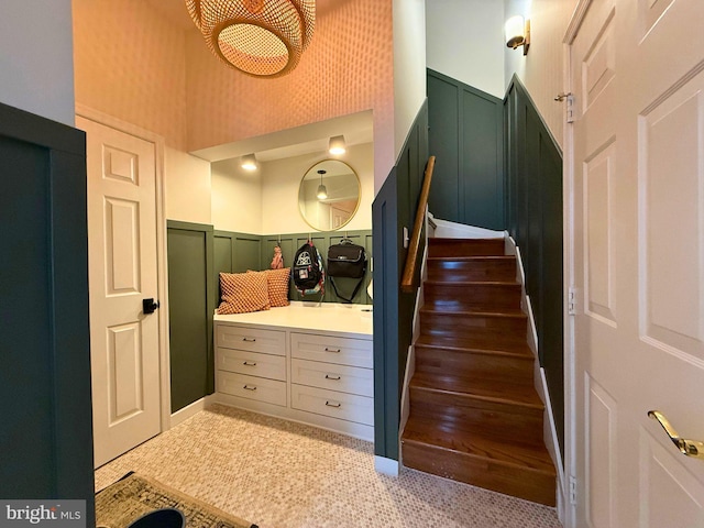 10000 Manor Pl, Fairfax, VA 22032 - stairway with a decorative wall, a towering ceiling, and a wainscoted wall