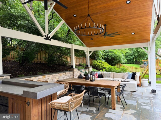 10000 Manor Pl, Fairfax, VA 22032 - view of patio featuring a gazebo, ceiling fan, outdoor dining space, and exterior bar