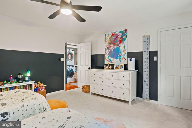 10000 Manor Pl, Fairfax, VA 22032 - bedroom with stacked washer and clothes dryer, light carpet, a ceiling fan, and baseboards