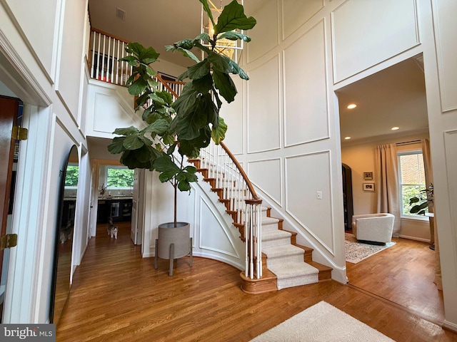 10000 Manor Pl, Fairfax, VA 22032 - entrance foyer featuring stairway, light wood-type flooring, a decorative wall, and recessed lighting