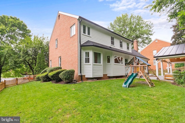 10000 Manor Pl, Fairfax, VA 22032 - back of property with a playground and brick siding